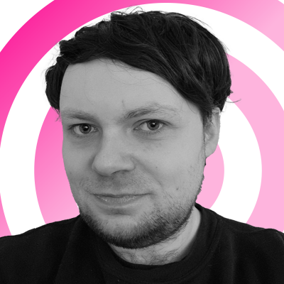 Rhys Wood headshot on a pink 'radar' background